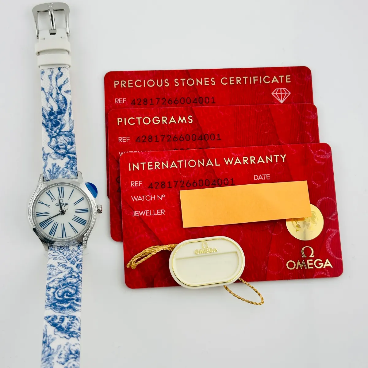 Omega De Ville Mini Tr√©sor Quartz White / Blue Roman Markers Dial on Fabric Strap Ref 428.17.26.60.04.001 with Card