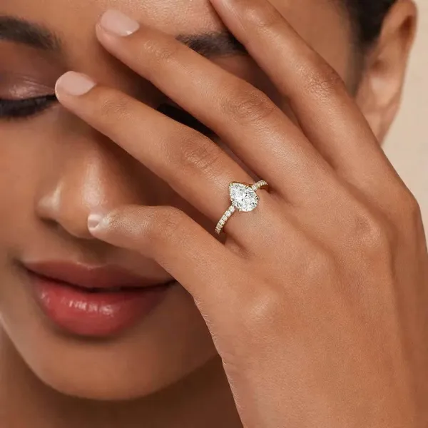 Pear Shaped Center Diamond And Round Lab Grown Diamond Ring